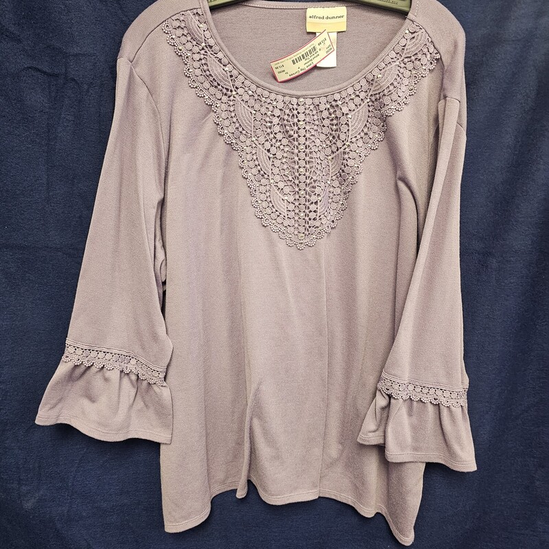 Love this three quarter sleeve knit top in purple with ruffled elastic cuffs and lace and studded chest piece. SOOOO CUTE!!!