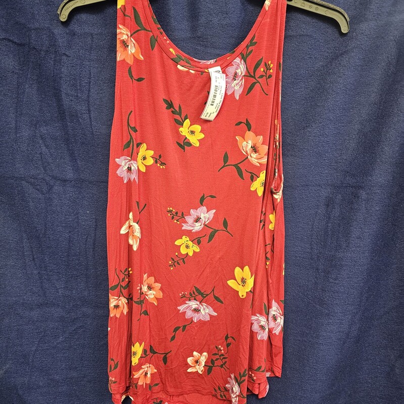 Red tank with floral desin in a knit material.