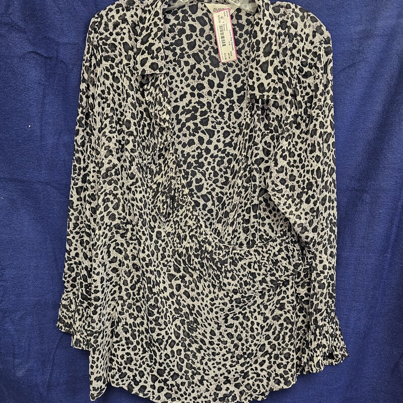 Wrap style blouse in black and white sheer animal print pattern.