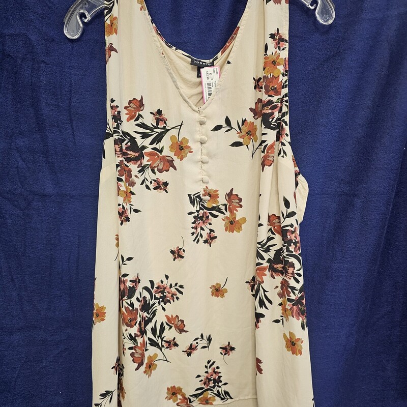 Cute tank top with solid cream knit back and a poly floral print front.