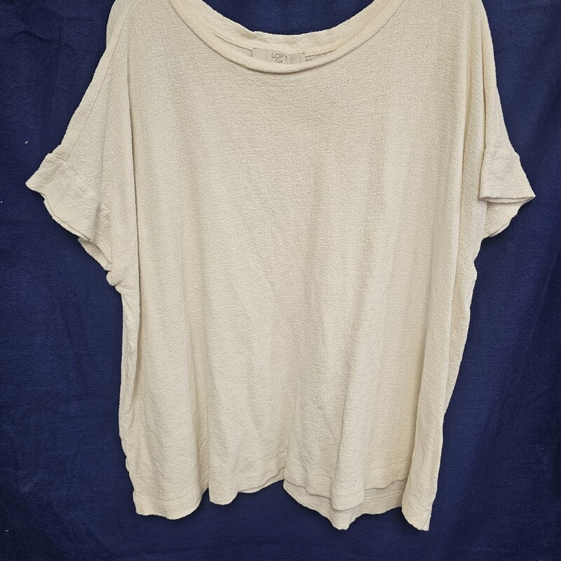 Short sleeve top in a creamy white. Perfect for year round wear