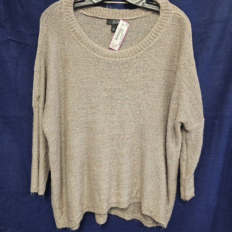 Super cute and soft light weight tan sweater with sparkles throughout!