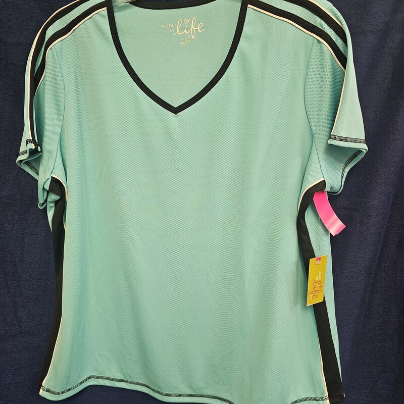 Brand new with tags, retails for $18. This short sleeve activewear top is done in in a teal blue with black trim.