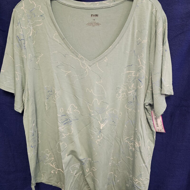 Short sleeve activewear top in a minty green with blue and white lined graphic print.