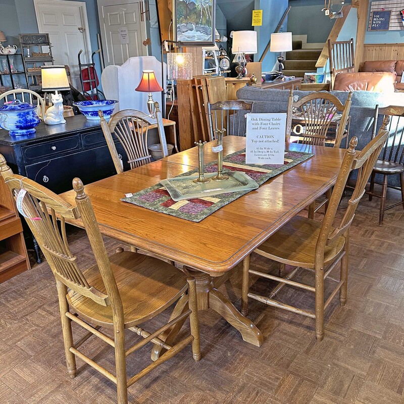 Oak Dining Table with Four Chairs and Four Leaves
65 In Wide x 41 In Deep x 30 in Tall.
Leaves are 1 Ft Wide each.