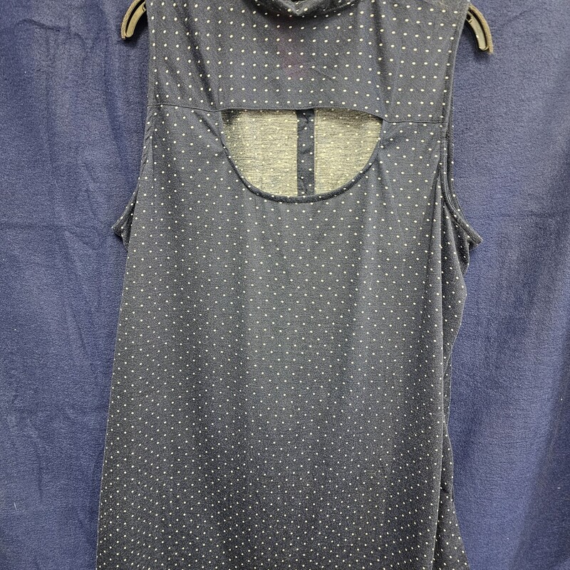 Cute sleeveless blouse in blue with white polka dots and tie front at the bottom hem  with a button up front