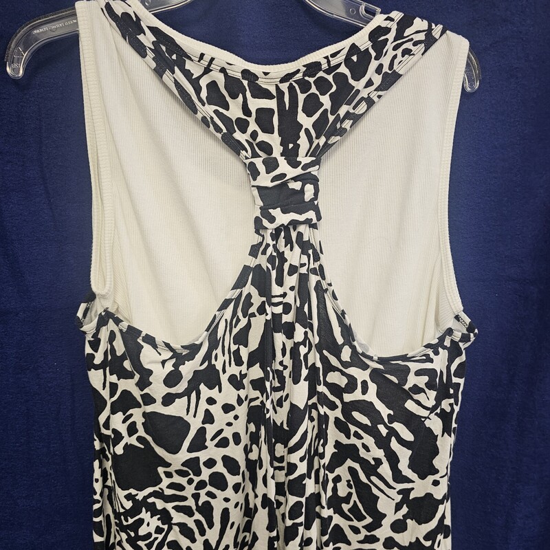 Double layer sewn together tank in white and black. Under tank is ribbed and white and the top layer is black and white print.
