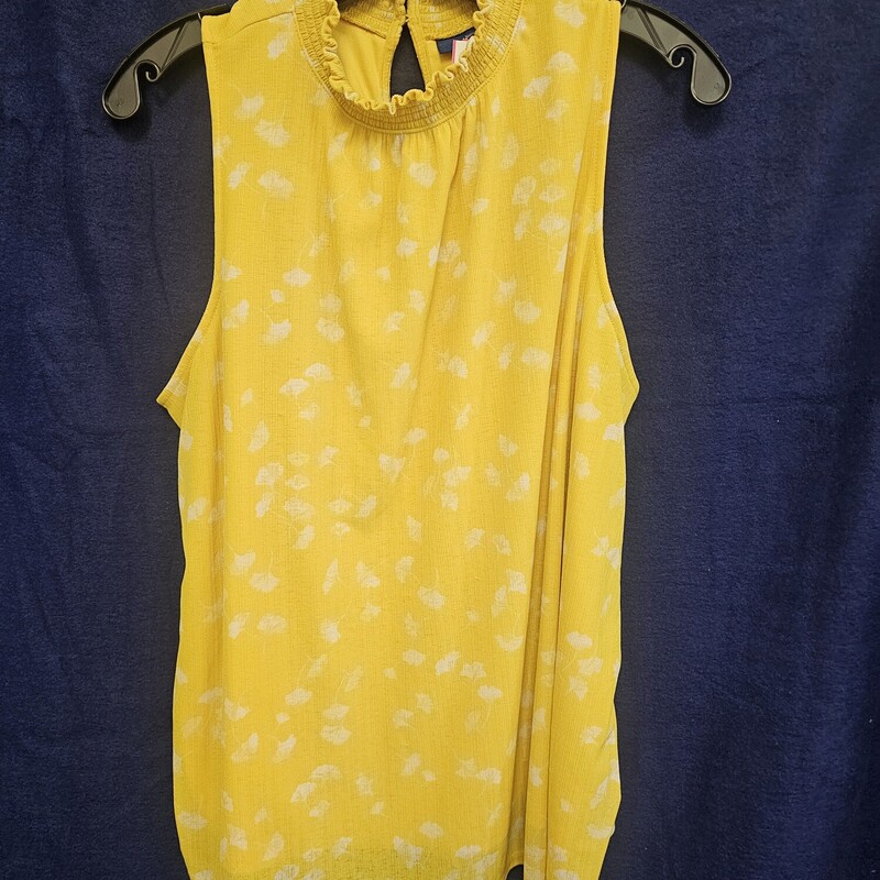 Sleeveless blouse in yellow and white fun pattern with high neck.