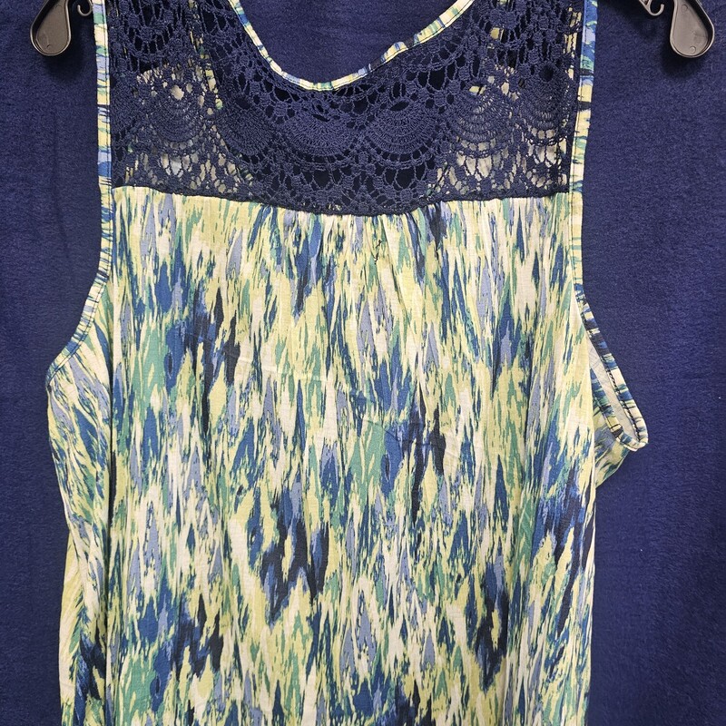 Super cute tank in yellow, green blues and white fun pattern. Back panel done in a navy blue lace