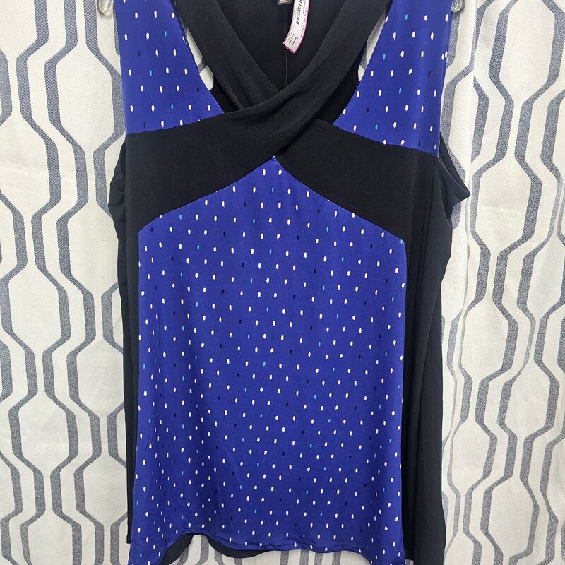 Super cute sleeveless blouse in blue and black. with mutli colored rectangular shapes. Back is solid black and super flattering to any body type.
