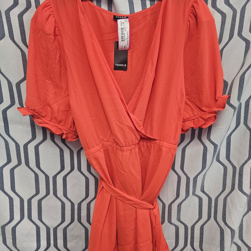 Super cute bright orange blouse with wrap style top and belted waist. Brand new with tags