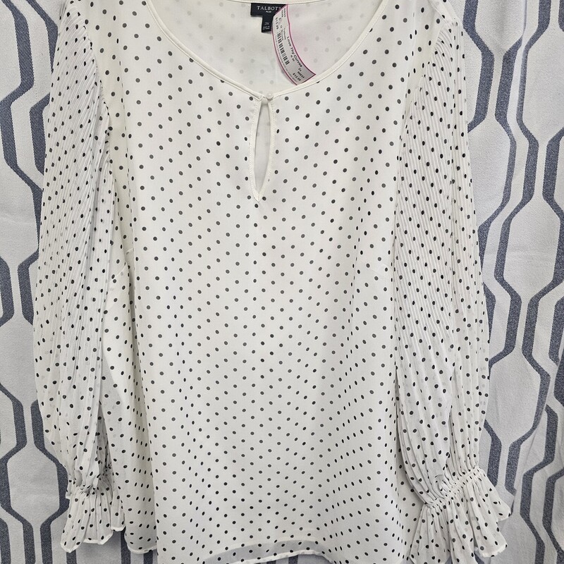 Super cute white blouse with black polka dots and sheer long sleeves.