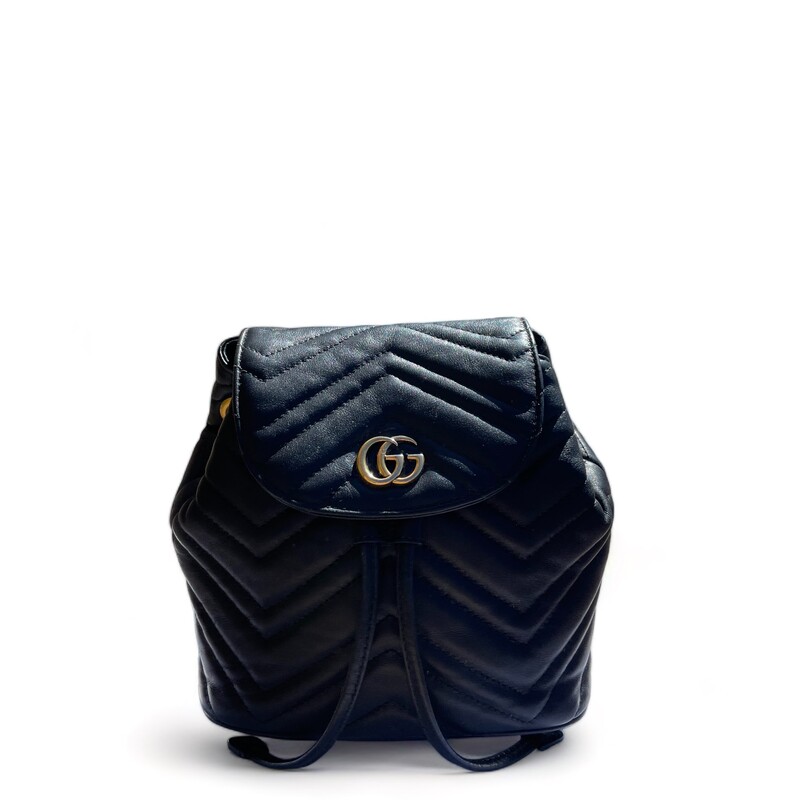 Gucci Marmont Black Backpack

Size Mini
Dimensions:
Width (at base): 7.5
Height: 7.5
Depth: 3.5
Shoulder Strap Drop: Adjustable, 14

This backpack is crafted of chevron-quilted calfskin leather in black. The backpack features adjustable shoulder straps, and an aged gold GG Marmont logo on the front. The front flap opens to a leather cinch cord, and beige microfiber interior with a patch pocket.

Some minor wear on leather
Some marks in the interior
Some minor discoloration of hardware