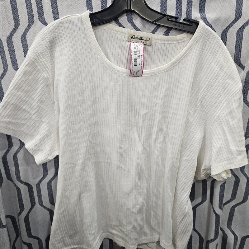 Short sleeve white knit top with more of a form fitting style cut