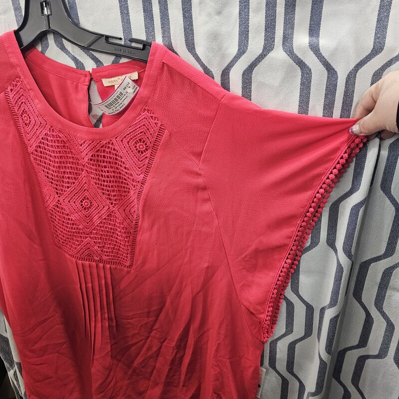 Brand new with tags, this blouse retails for over $49! This blouse is done in red and will flattery any body type.