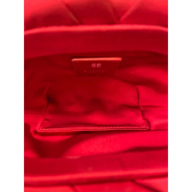 GIVENCHY Satin Mini Kenny Shoulder Bag in Red.<br />
The bag is crafted of satin fabric in red. It features a silver chain shoulder strap with a removable padlock bag charm on the front. The top secures with a magnetic closure and leads to a matching fabric interior.<br />
<br />
Year: 2020<br />
Size:Mini<br />
<br />
Dimensions:Base length: 10.25 in<br />
Height: 5.25 in<br />
Width: 0.75 in<br />
Drop: 4.50 in