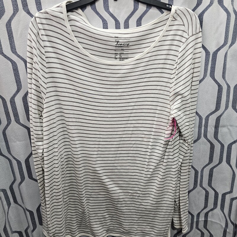 Long sleeve knit top that is light weight and done in a white and black stripe.