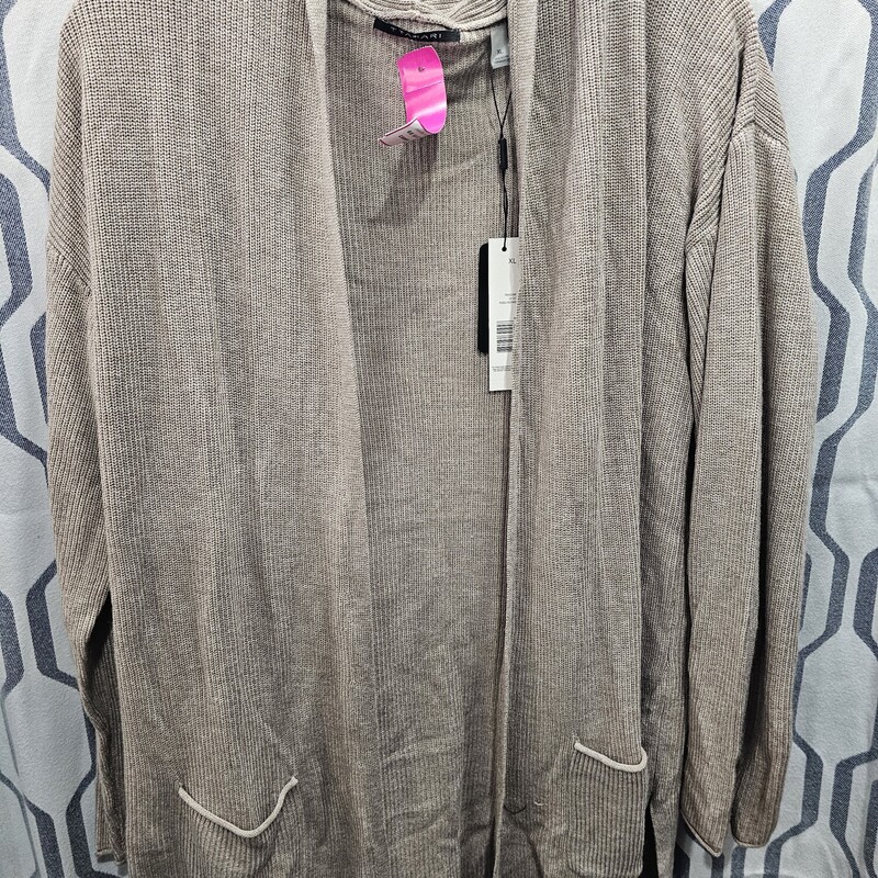 Brand new with tags, this cardigan is in a light brown and is a cashmere blend. Can we say super soft?? Light weight and so cute for year round wear
