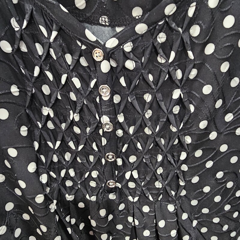 Cute blouse in black with white polka dots.