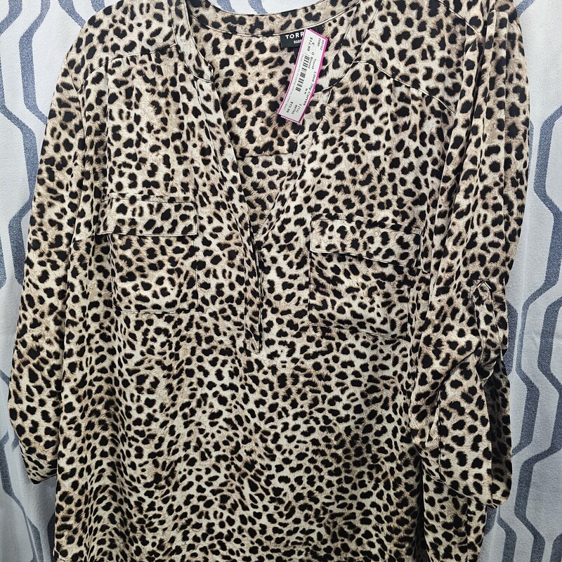 Half sleeve blouse in a brown and black leopard print.
