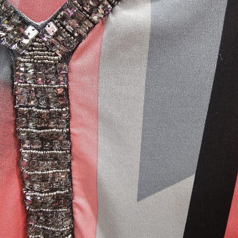 Half sleeve blouse in pinks, grey and black with beading along the neckline.