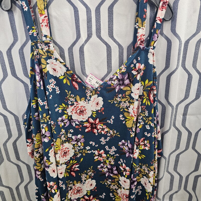 Beautiful cold shoulder style blouse in a blue teal with floral print.
