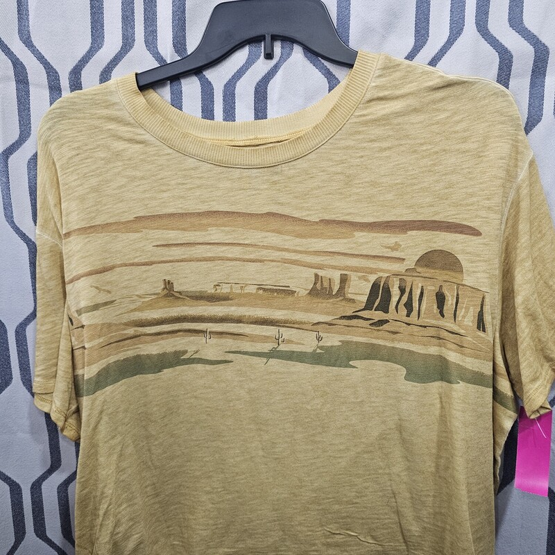 Not quite crop but runs short, this tee is short sleeve in a yellow with desert graphic.