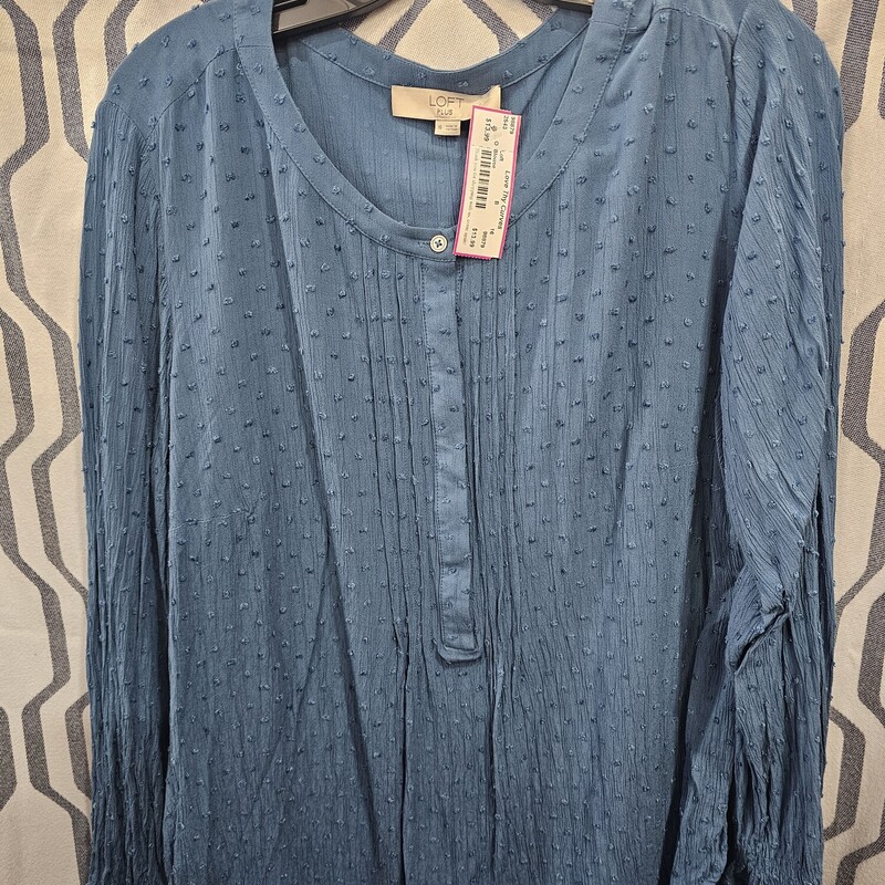 Long sleeve blouse in blue with polka dot pattern in the material