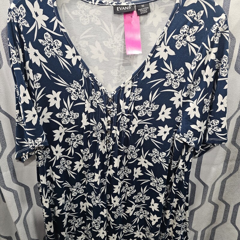 Super cute short sleeve knit top in teal and white floral pattern.