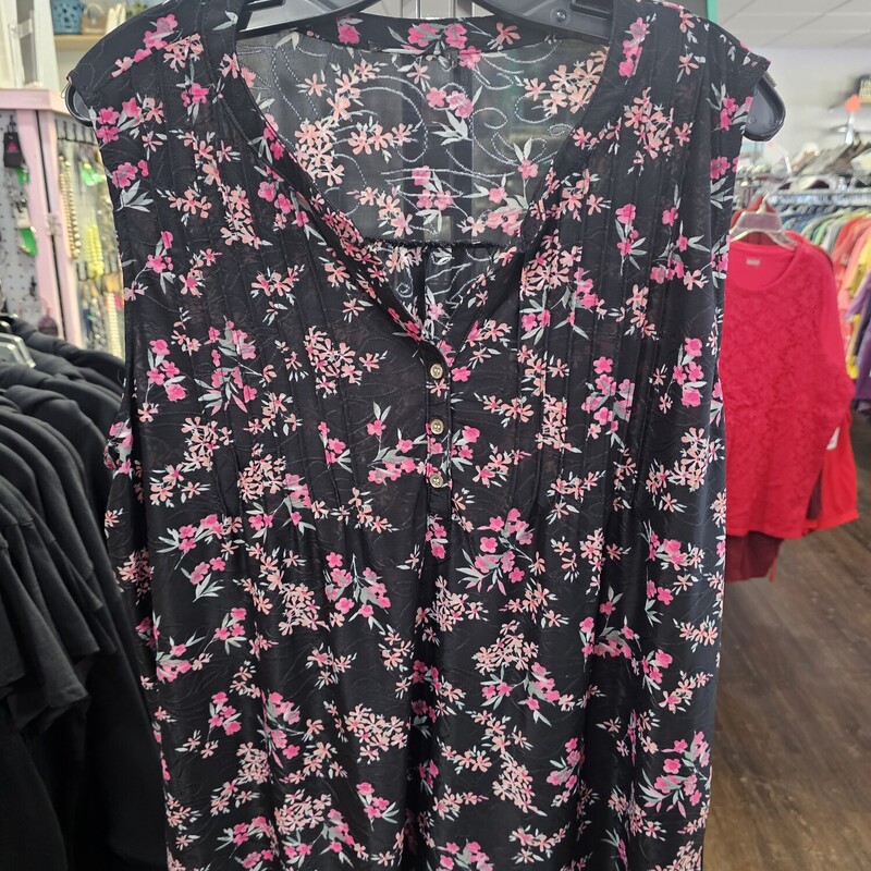 Sleeveless blouse in black with floral pink print.