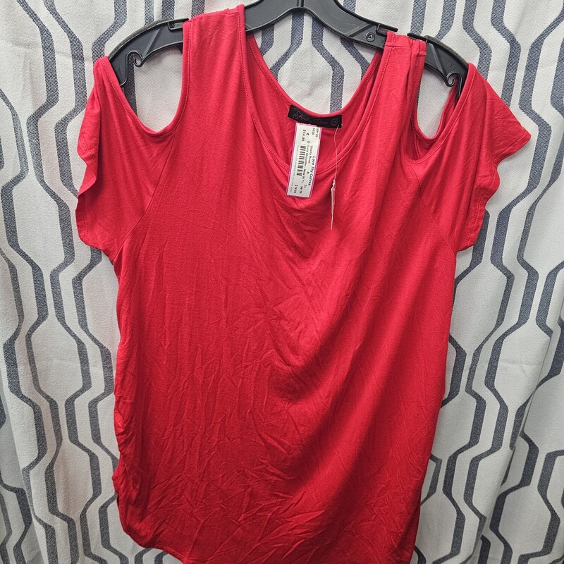 Brand new with tags this tee is done in red with cold shoulder cut outs.