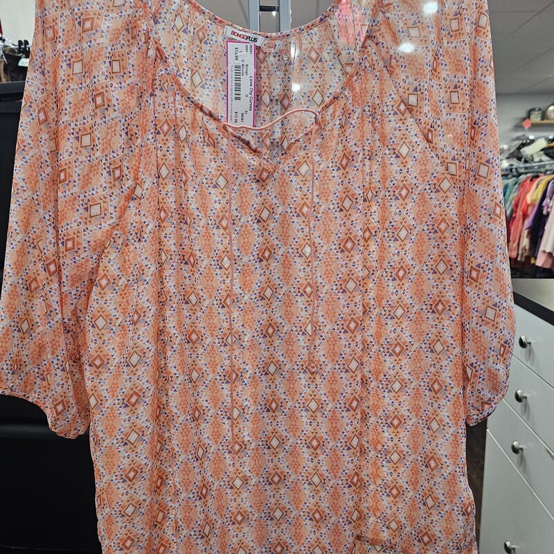 Sheer half sleeve blouse in orange with fun print.