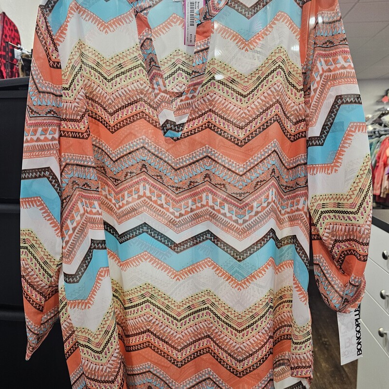 Sheer half sleeve blouse in a fun orange, yellow, blue and white print.