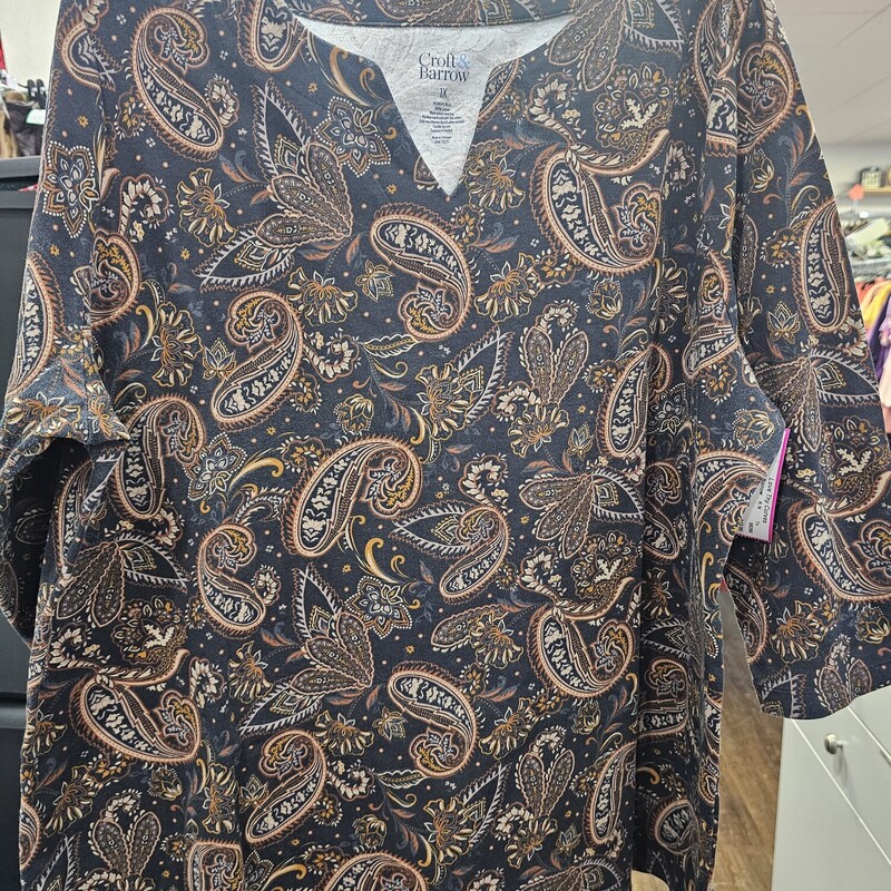 Year round wearability this half sleeve knit top is black with brown paisley pattern.