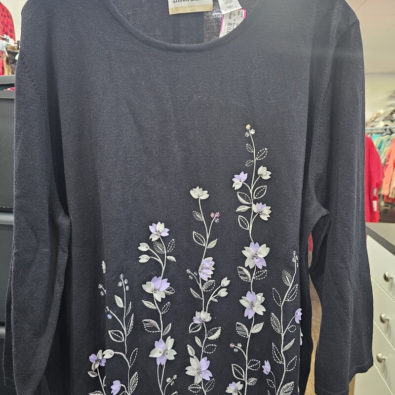 Long sleeve lighter weight sweater in black that can be worn year round. Lavender floral design embroidered. Beautiful