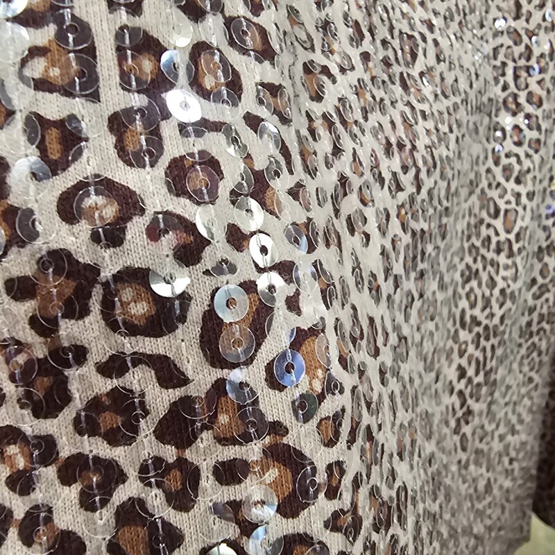 Half sleeve knit top in brown animal print and covered in clear sequins for sparkle.