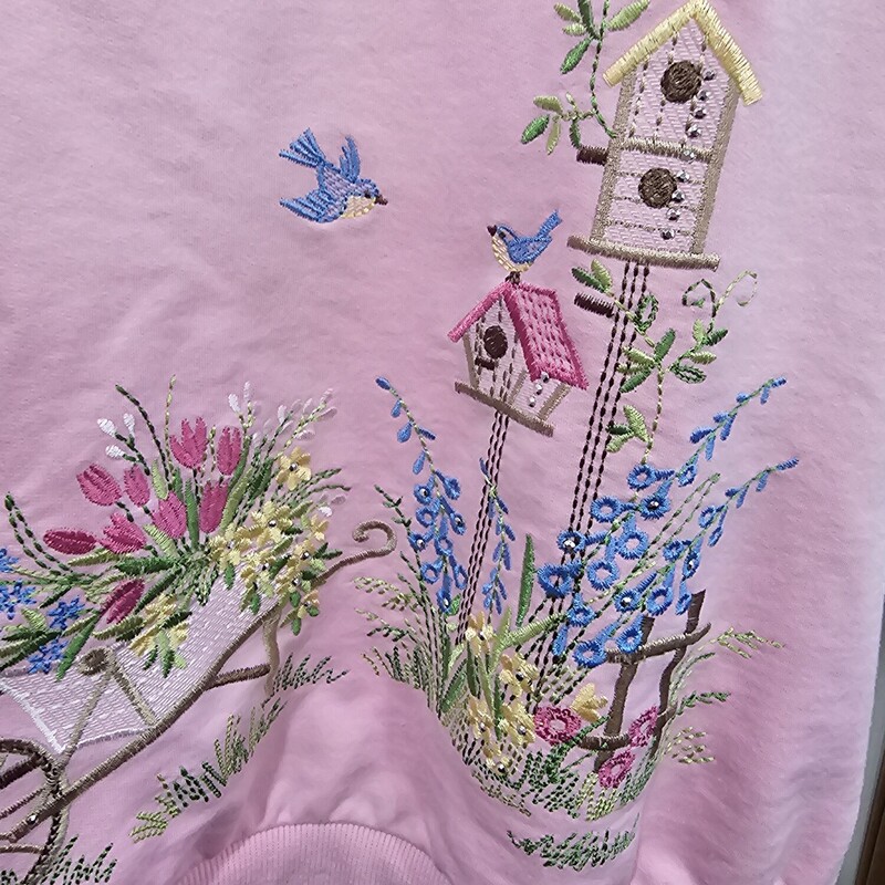 Short sleeve polo style knit top with zipper in pink with the CUTEST scene embroidered on it.