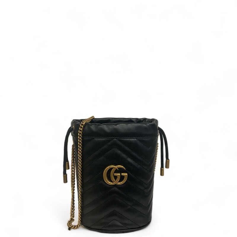 Gucci Marmont Bucket, Black
Size: Mini
Dimensions:
Base length: 5.00
Height: 7.00 in
Width: 4.00 in
Drop: 22.50 in

Calfskin Matelasse Mini GG Marmont 2.0 Bucket Bag in Black. This soft-structured bucket bag is crafted of soft calfskin leather in black with a beautifully stitched chevron pattern. It features an aged chain shoulder strap, a top cinch cord and an aged gold interlocking GG logo. On the back of this beautifully crafted bag, there is a heart stitched design. This bag opens to a beige microfiber interior with card slots and a removable key ring.
