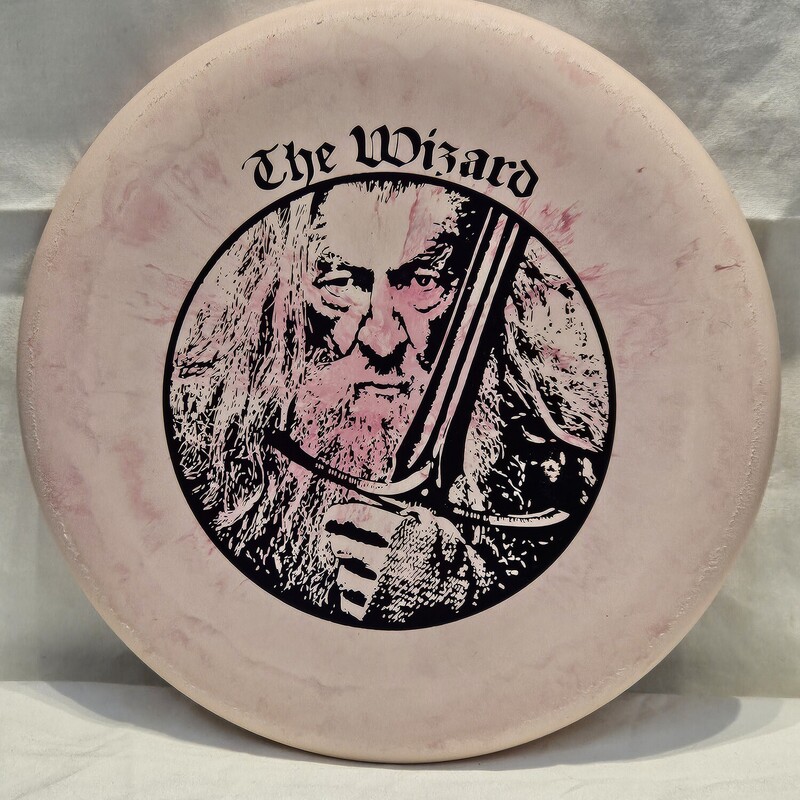 Gateway The Wizard Special Blend Disc Golf Disc

Type: Putt & Approach

Flight Rating: 2/3/0/2 Speed/Glide/Turn(R)/Fade(L)

Weight: 175g

Stability: Stable

Color: Marbled Pink w/ Purple Foil Print

Condition: New
