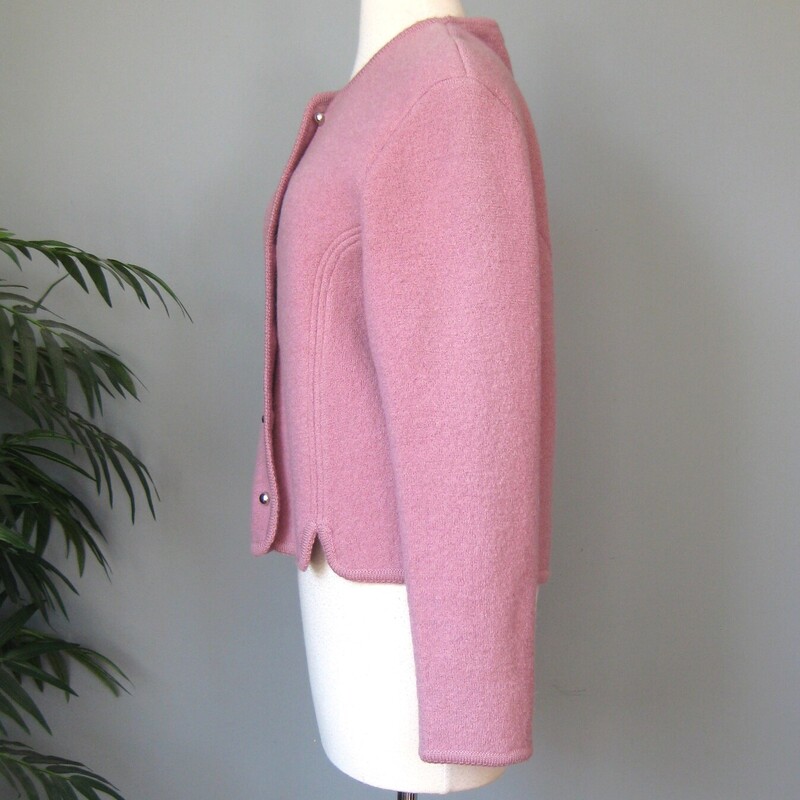 Vtg Ashley Boiled Wool, Blush, Size: Vtg 14
Nice warm pretty cool tone mauve-y pink boiled wool cardigan sweater from Ashely.
Small Round silver metal buttons, knitted braid trim and a notched shape at the hem.
100% wool
Made in Hong Kong

it's  marked size 13/14, but better for a modern size Medium or small depending on the fit that you like.

Here are the flat measurements, please double where appropriate:
Armpit to armpit: 20.5
shoulder to shoulder: 17
width at hem: 19
Overall length: 22.5

Thanks for looking!
#65927