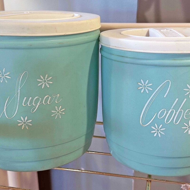 Vintage Plastic Aqua and White Coffee (6 In Tall) and Sugar (7 In Tall) Canisters.
Fun colors for your kitchen.