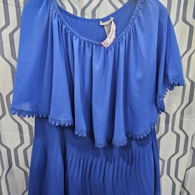 Love this flattering blouse in a blue- tank style fit with overlay to cover the top half of the arms.