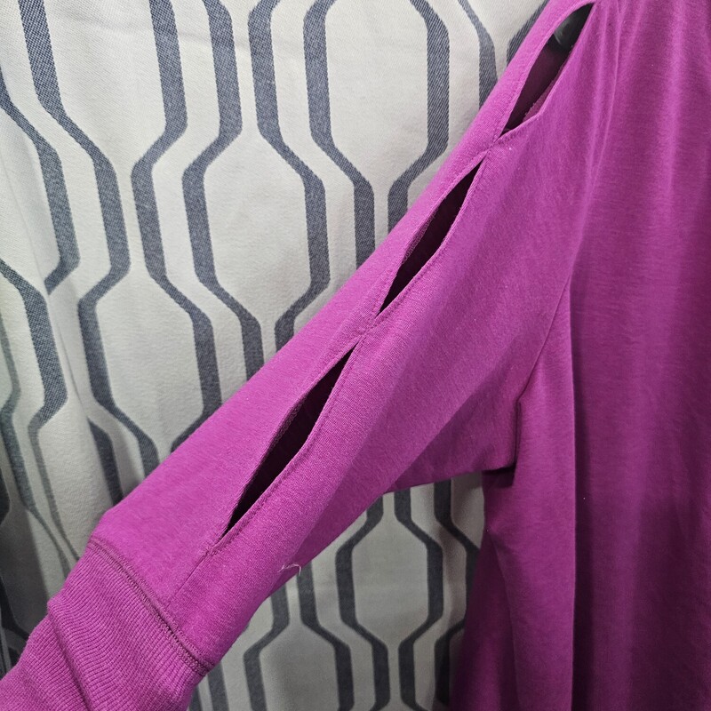 Half sleeve knit top in purple with cut outs down the whole sleeve. Super cute.