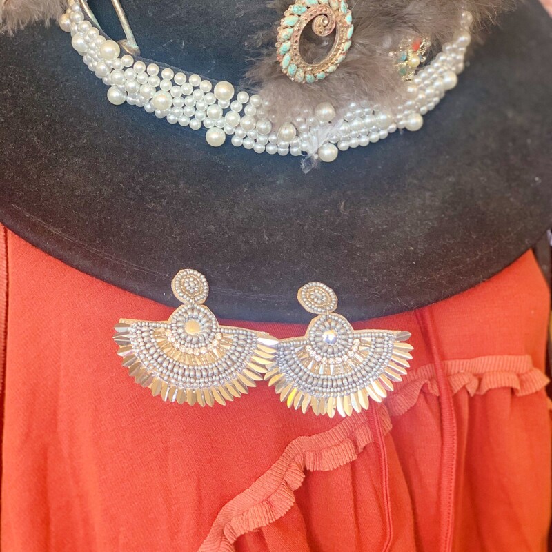 Dress your outfit up with these gorgeous Silver boho earrings! Their layered beads make for an elegant look. Pair them with a cute top and head out for the night!