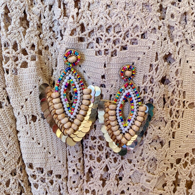 Dress your outfit up with these gorgeous gold boho earrings! Their layered beads make for an elegant look. Pair them with a cute top and head out for the night!