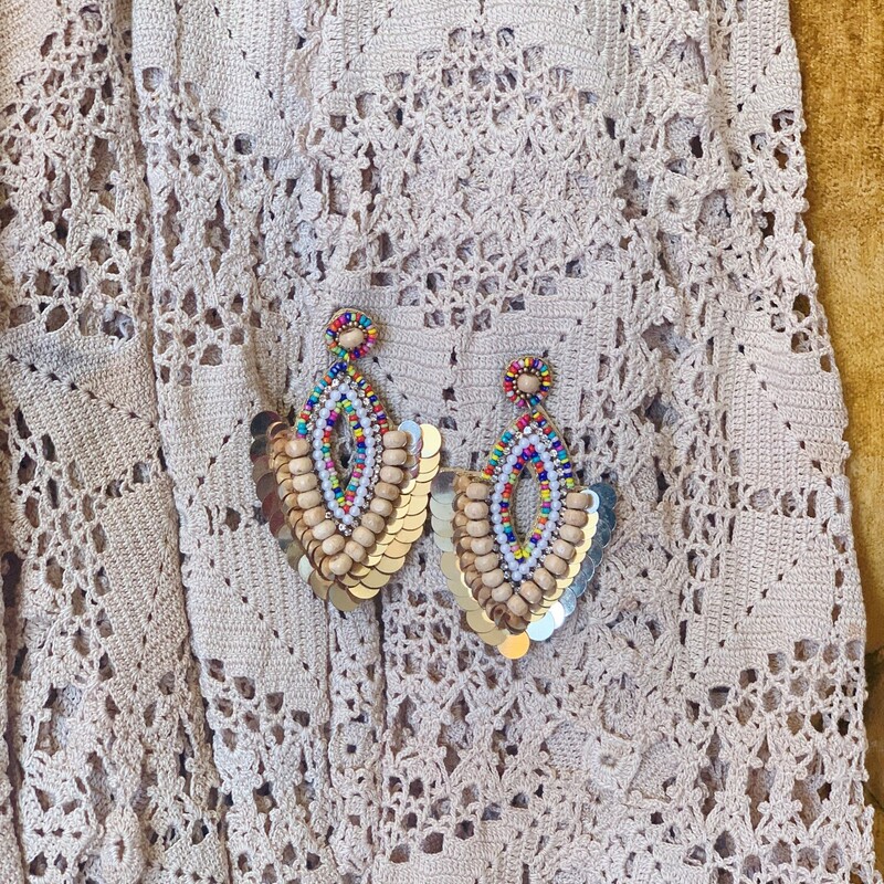 Dress your outfit up with these gorgeous gold boho earrings! Their layered beads make for an elegant look. Pair them with a cute top and head out for the night!