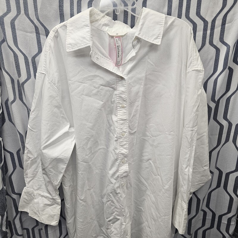 White long sleeve button up shirt that can be belted and made into a dress or paired with some amazing leggings.