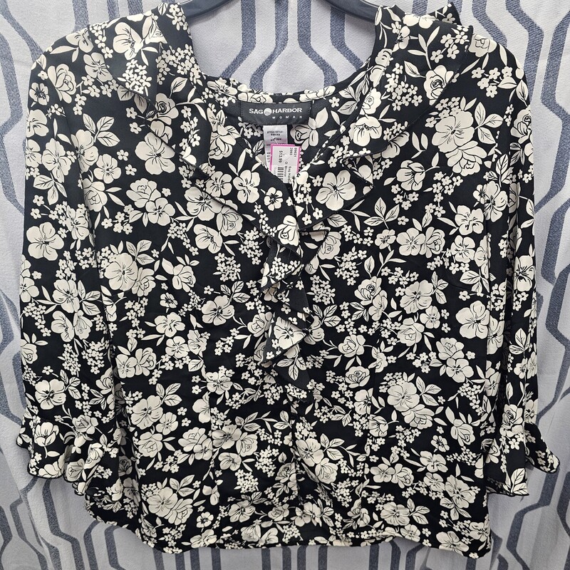 Long sleeve but light weight blouse in black with white floral print.