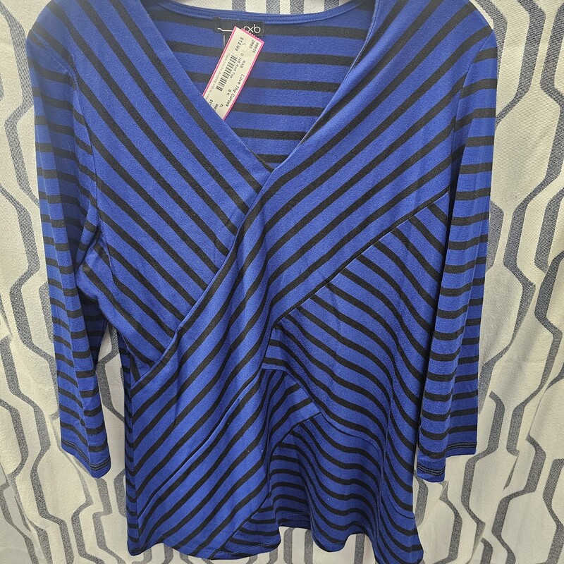 Half sleeve knit top in a blue and black stripe.