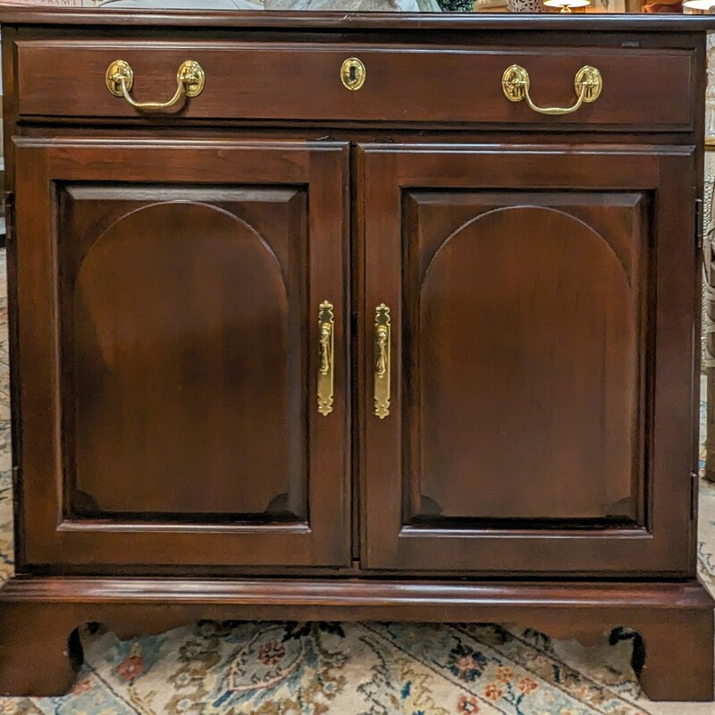 Harden Cherry Cabinet
Dark Brown Gold Size: 32 x 11 x 29H
2 doors - 1 shelf inside
1 small drawer at top